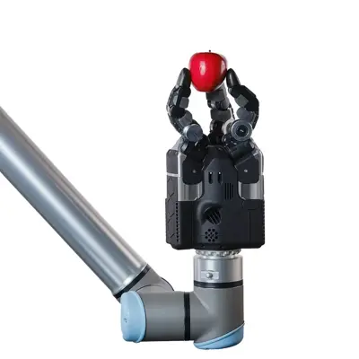 Robot hand holding a red apple