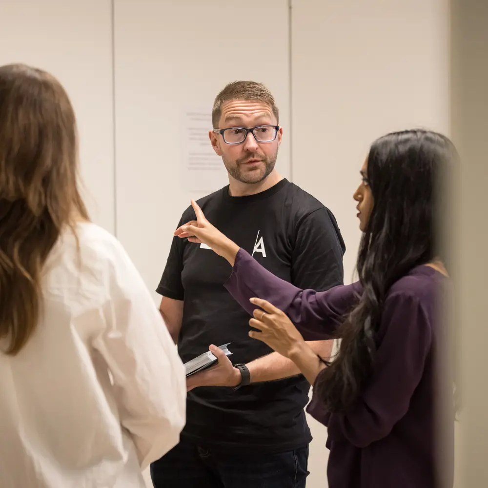 A photo of Mark Symes in conversation.