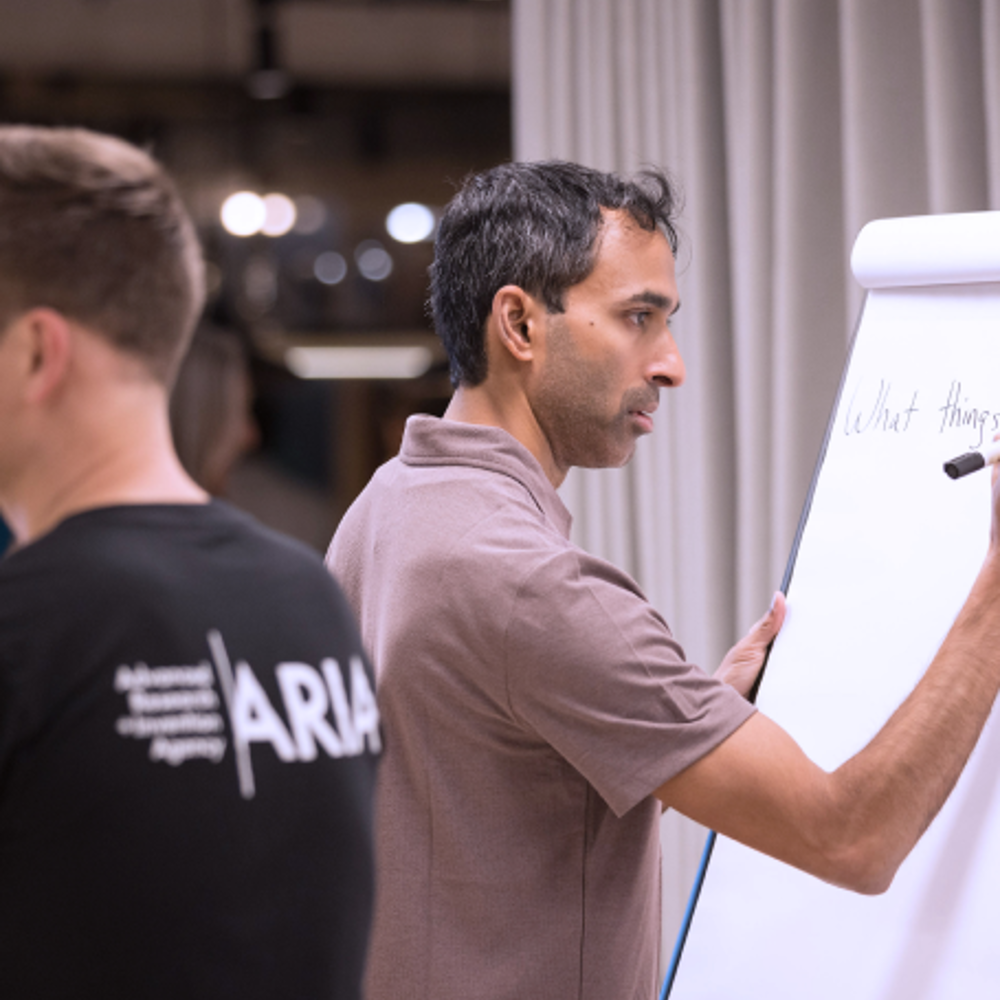 Suraj Bramhavar writing on a whiteboard