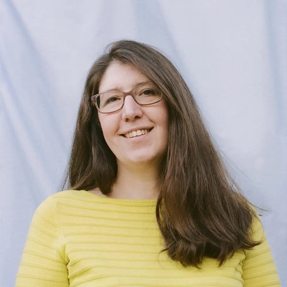 Photo of Claire Donoghue against a blue background