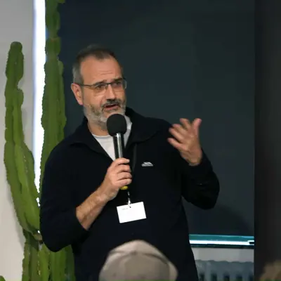 ARIA CTO Ant Rowstron speaking at an event.