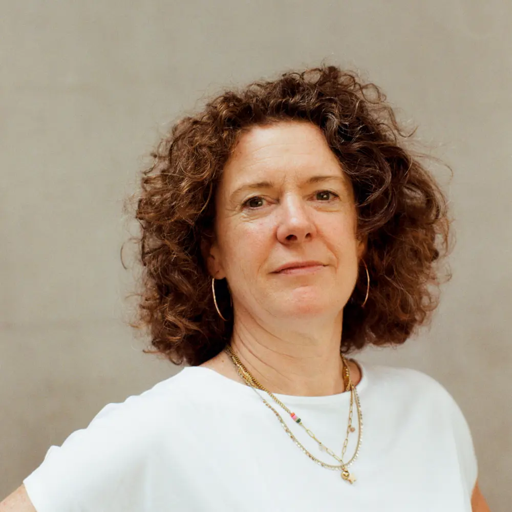 Headshot of Sarah Hunter against a cream background