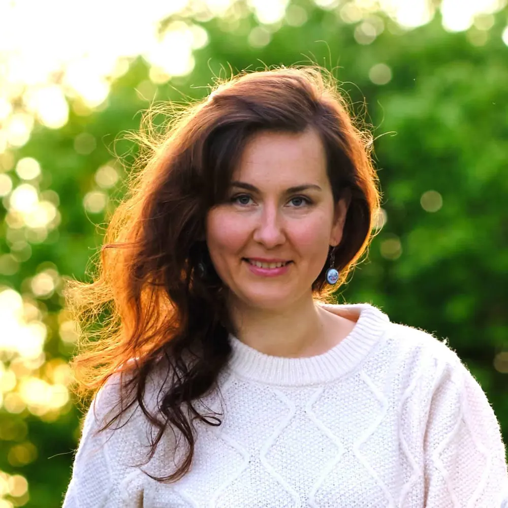 Photo of Elena Kavanagh standing in front of some trees