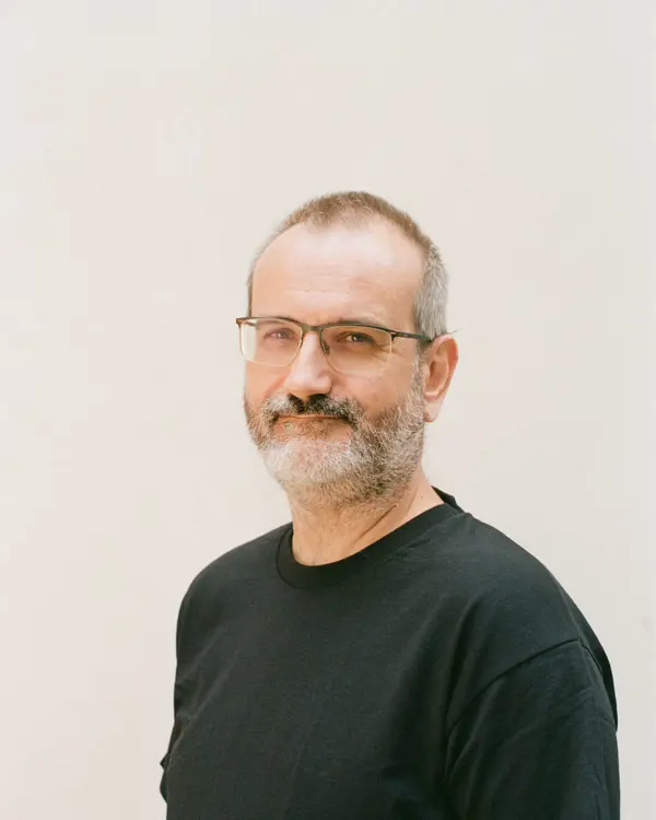 Photo of Ant Rowstron against a cream background