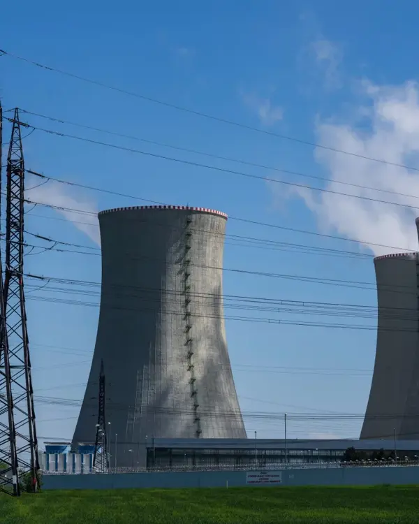 Nuclear power plant with cooling towers and transmission lines